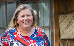 Danielle Bergin outside some of the Island Child Charitable Trust's emergency housing.