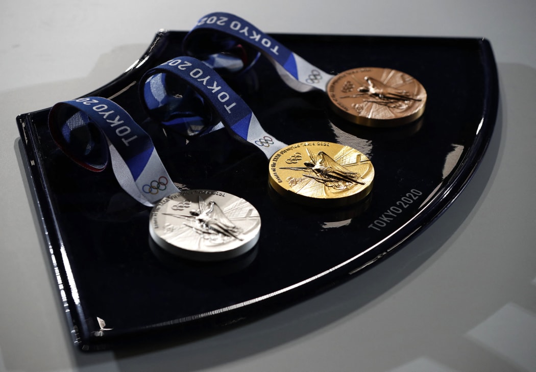The medals and tray to be used for the medal ceremonies at the Tokyo 2020 Olympics Games are seen during an event to mark 50 days to the opening ceremony, at Ariake Arena in Tokyo on June 3, 2021.