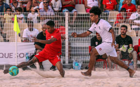 Tahiti's Gervais Chan Kat (Left) is pressured by a Tongan player at the OFC Beach Soccer Nations Cup 2019. Aorai Tini Hau, Tahiti, Tuesday 18th June 2019.
