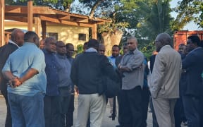 Vanuatu Government MPs milling outside court