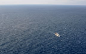 This handout picture taken and released by Russia's Emergency Ministry on April 2, 2015 shows ships carrying out a search operation in the Sea of Okhotsk where the trawler Dalny Vostok has sunk. At least 54 dead in trawler sinking off Russia'a Far East.