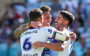 Shaun Johnson of the Warriors celebrates with teammates after scoring.