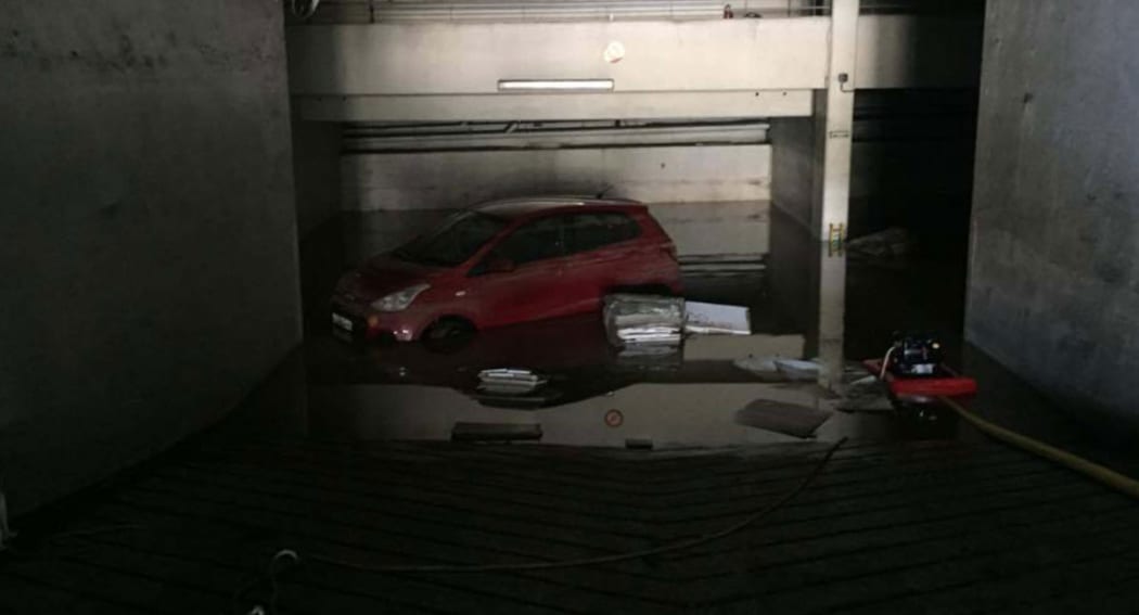 A car was flooded after severe storms hit Tahiti.
