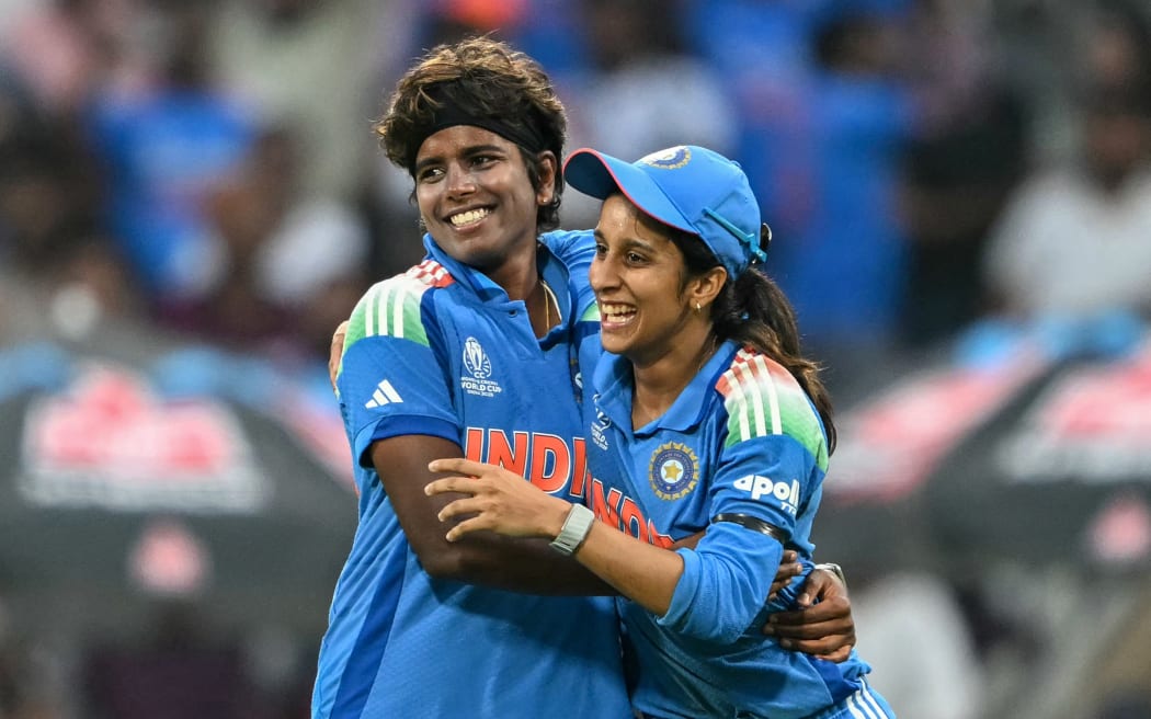 India's Jemimah Rodrigues (R) celebrates with Arundhati Reddy after taking an Australian wicket during their World Cup semi-final.