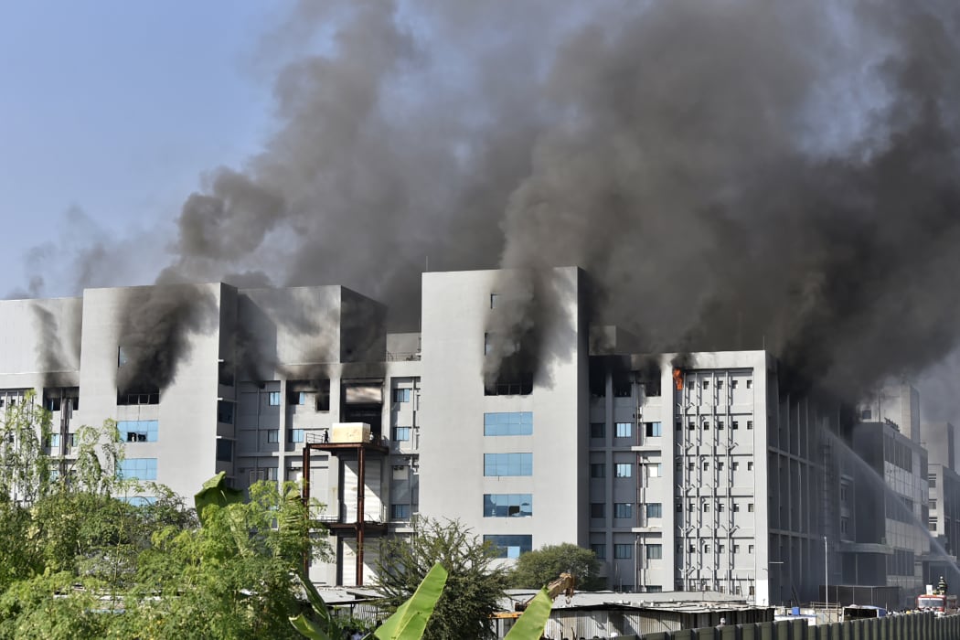 Smoke rises after a fire broke out at India's Serum Institute in Pune on January 21, 2021.