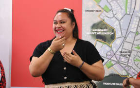 Tongan parliamentary staffer Veisinia Latu performs with Tāmaki Regeneration Company staff in Auckland