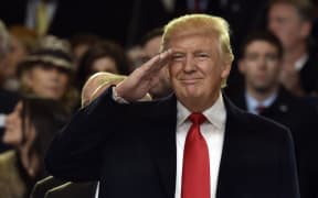 President Donald Trump salutes during the inauguration parade.