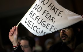 A crowd of protesters gathers outside of the Brooklyn Federal Courthouse as a judge hears a challenge against President Donald Trump's executive ban on immigration from several Muslim countries, on January 28, 2017 in Brooklyn.