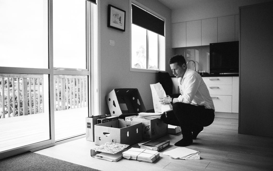 McKinnel looks through files he's amassed during his investigation of Gail Maney's murder conviction