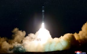A photo released by North Korea's official Korean Central News Agency (KCNA) shows launching of the Hwasong-15 missile.