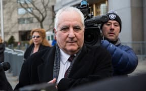 Daniel Bonventre leaves court after being found guilty of aiding, assisting and profiting from the Ponzi scheme run by Madoff.