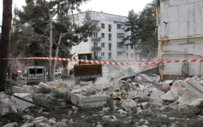 The rubble carpets the premises of an apartment building ruined by a Russian rocket strike, Chuhuiv district, Kharkiv Region, northeastern Ukraine.