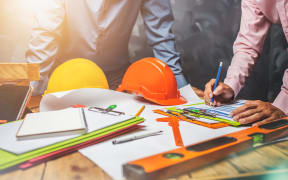 Structural engineer teamwork discussing hardworking in the office on building structure concept of worldwide building project.