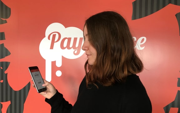 Larissa Godfrey using the Pay Sauce app