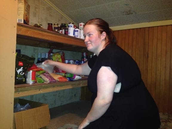 Ashley Hollings in the foodbank she has created in her home in Massey, west Auckland.