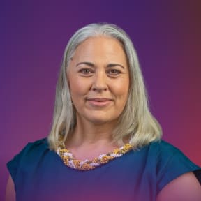 A head and shoulders crop of host Susana Lei'ataua on a dark purple and pink gradient background representing the colours of dawn