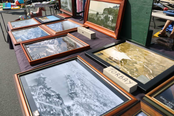 Martin Adlington's Sunday market stall where he's displayed old aerial photos of local areas.