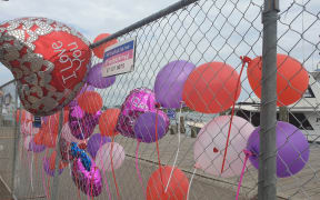 Tributes left at White Island Tours base after families returned this morning.