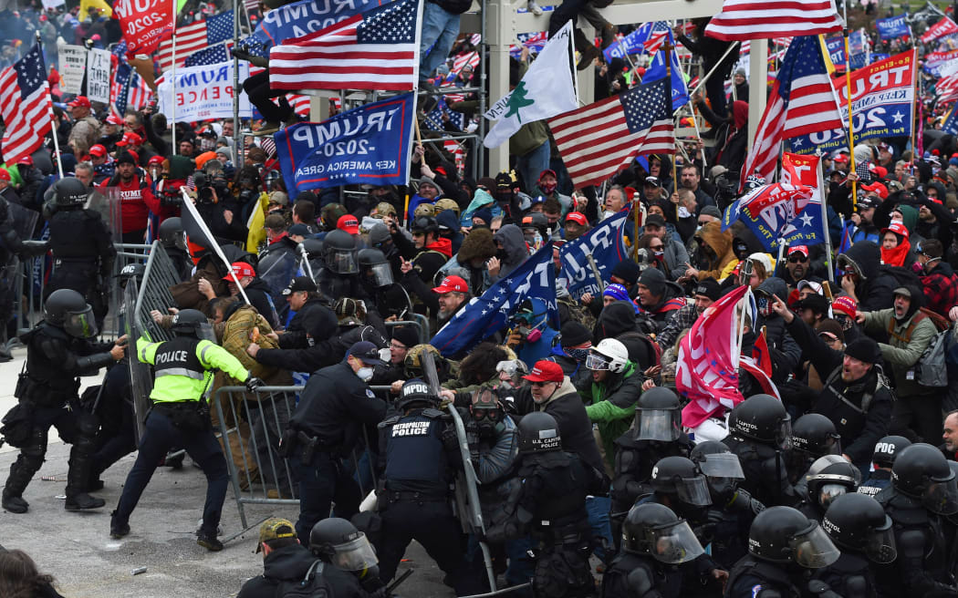 Trump supporters clash with police and security forces as they push barricades to storm the US Capitol in Washington D.C on 6 January, 2021.