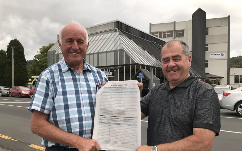 Democracy Northland campaigners John Bain (left) and Robin Grieve (right) are spearheading New Zealand’s biggest Māori wards opposition polling demand campaign outside Northland Regional Council’s head office in Whangārei.