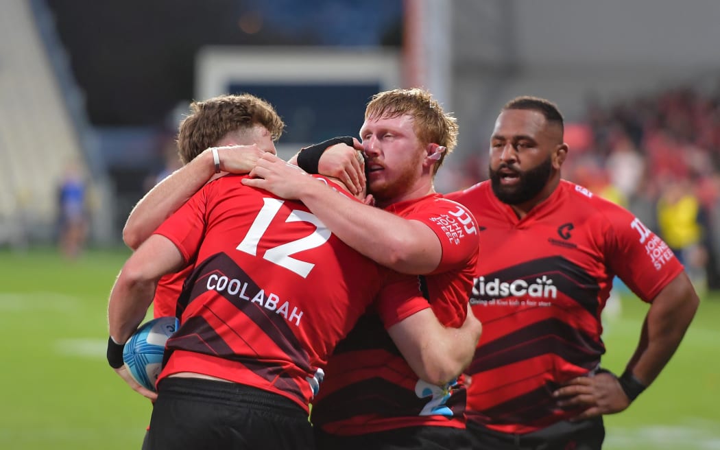 The Crusaders celebrate Dallas McLeod's try.