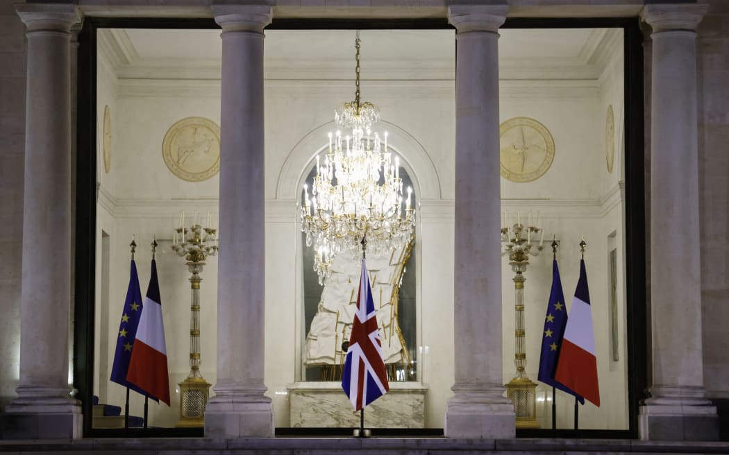 The Union Jack is seen at the entrance of the Elysee presidential palace in Paris after the annoucement of the death of Queen Elizabeth II, on September 9, 2022.