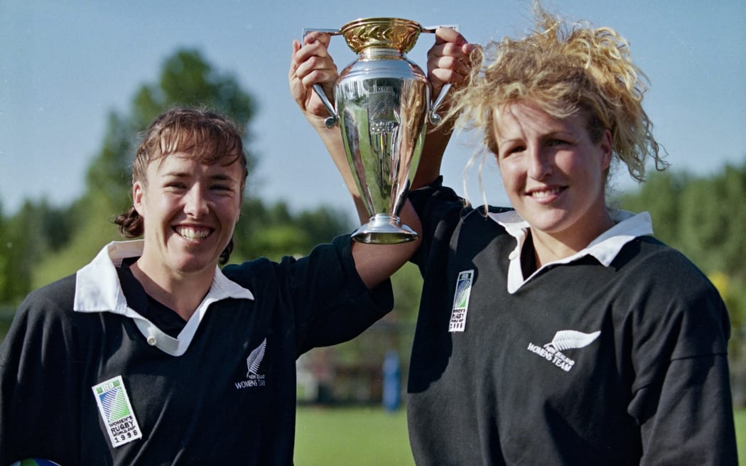 Sisters Anna & Fionna Richards celebrate with the trophy after winning the 1998 Womens Rugby World Cup.