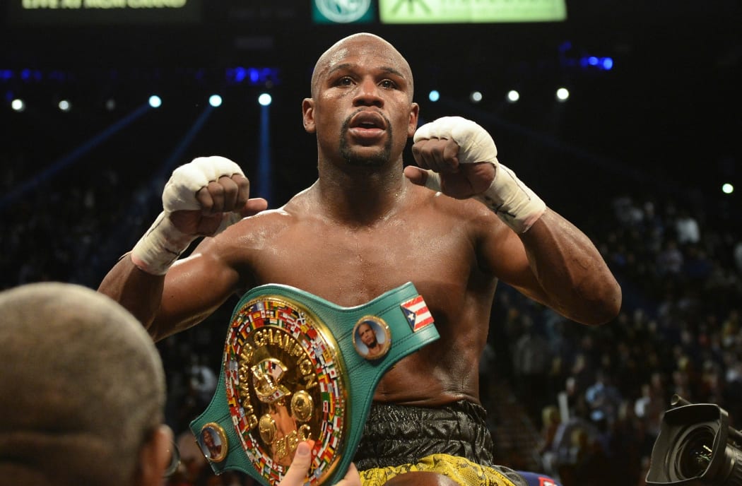 Floyd Mayweather, Jr. celebrates after winning the WBC welterweight title bout in Las Vegas.
