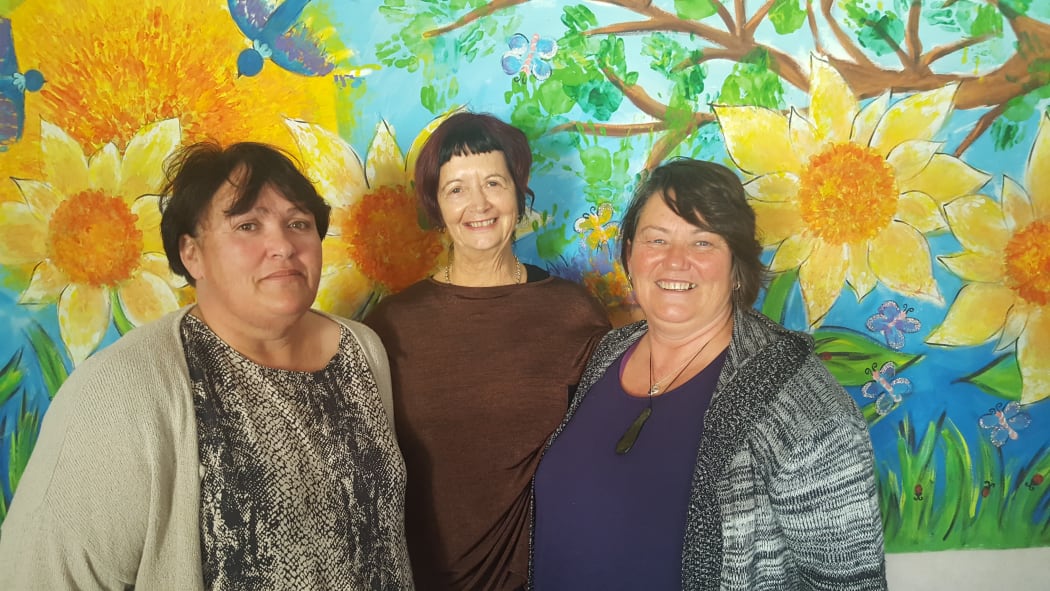 Family Works Whangarei social workers: Louise Walker, Margie Matthews and Michelle Arkin. Mural by their young clients.