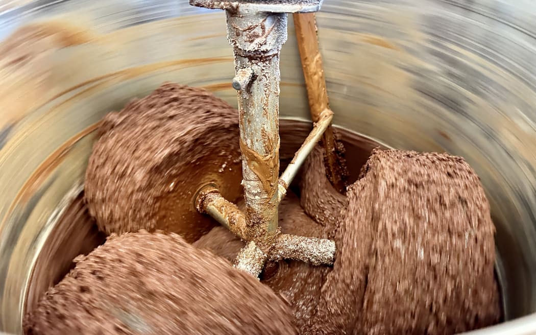 Ocho chocolate being spun in machine.
