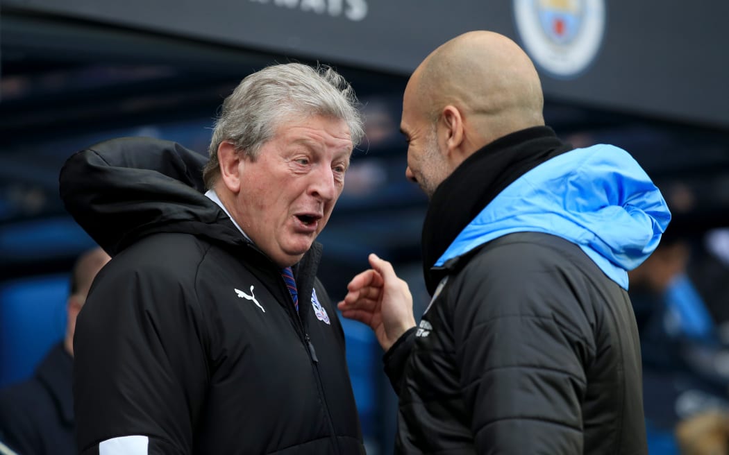 Crystal Palace manager Roy Hodgson speaks to Manchester City manager Pep Guardiola.