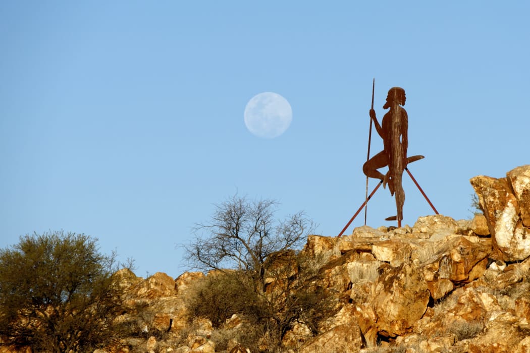 Aboriginal figure with full moon, Cue, Murchison, Western Australia | usage worldwide