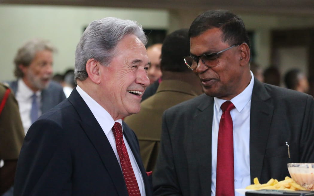 NZ deputy prime minister and foreign minister Winston Peters shares a moment of levity with Fijian deputy prime minster and minister of finance Biman Prasad at a cocktail function in Suva on 16 December, 2023.