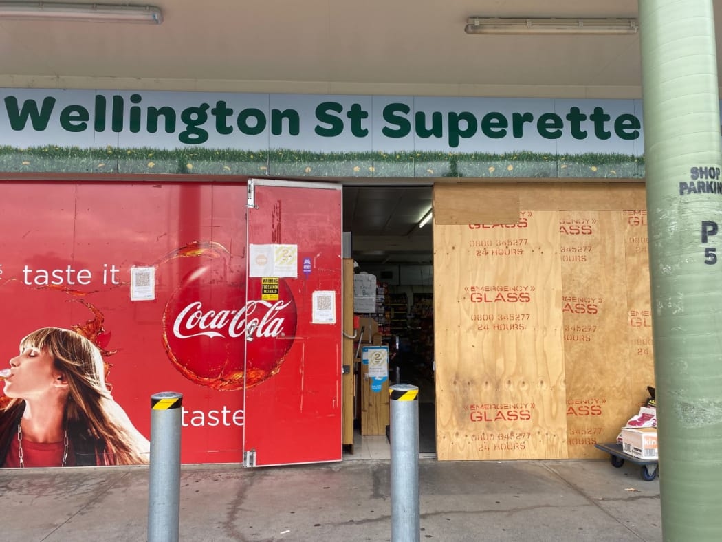 A shop's damaged store front afer it was rammed.