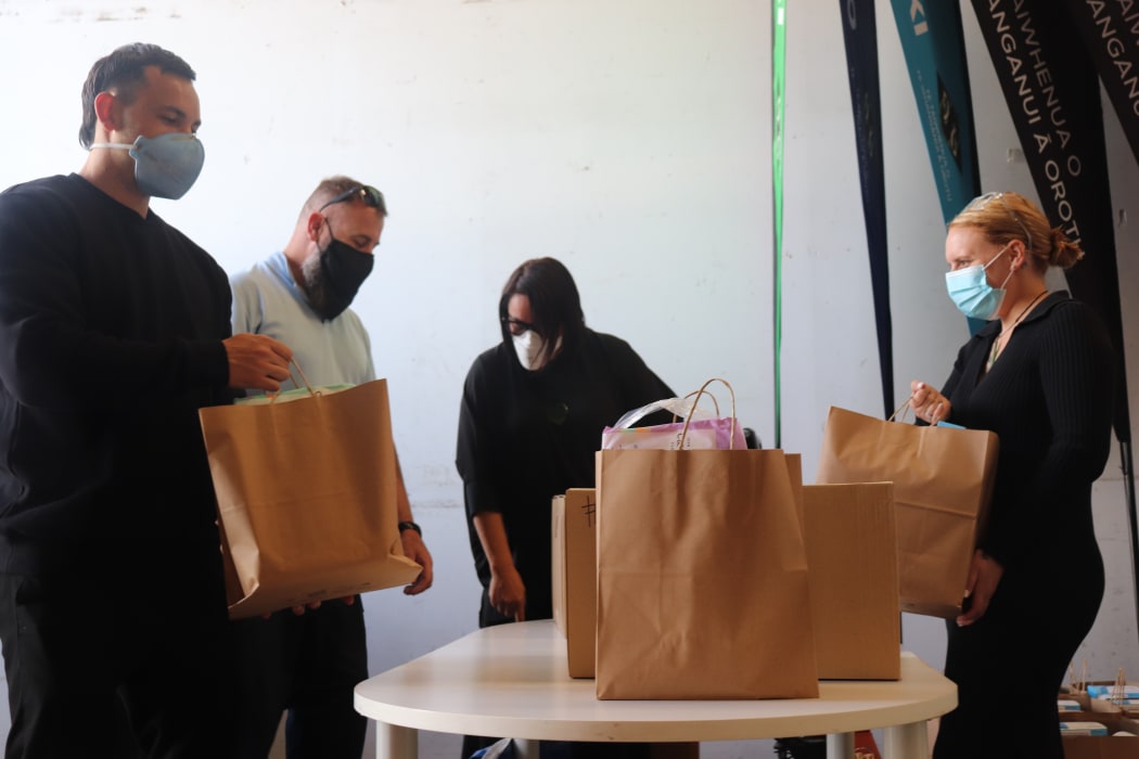 A group from Te Taiwhenua o Te Whanganui ā Orotu get ready to deliver kai parcels to whānau