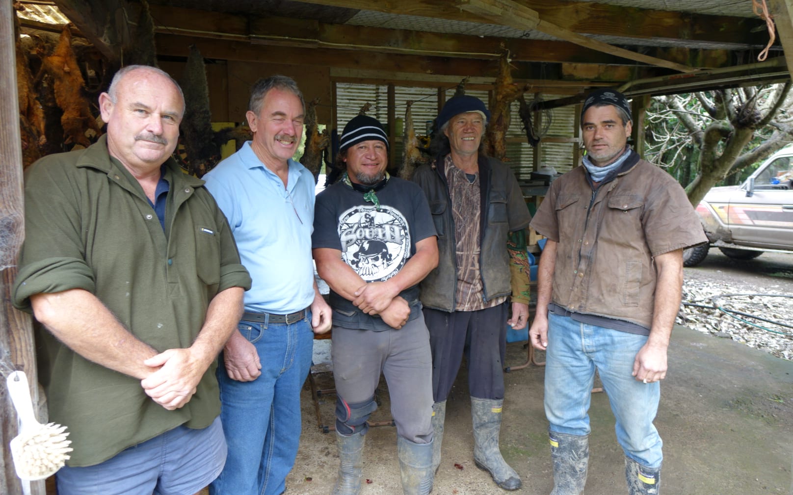 Northland Regional Council pest controller Mike Knight, councillor Joe Carr, Todd Emery, Bobby Proctor and a junior trapper.