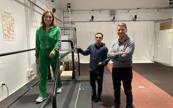 Stacey Morrison on a treadmill at the movement neuroscience laboratory at the University of Auckland with Pablo Ortega Auriol and Professor Winston Byblow.