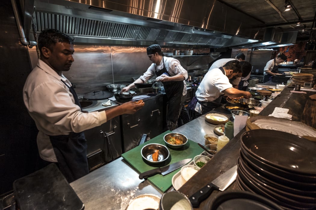 Kitchen staff in Cassia Restaurant on Fort Lane, Auckland City.