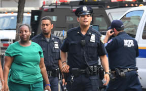 Police look on outside the Bronx-Lebanon Hospital as police respond to an active shooter north of Manhattan in New York on June 30, 2017.
