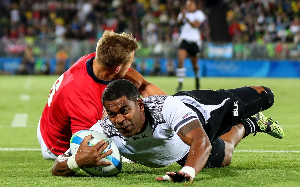 Fiji’s Vatemo Ravouvou scores a try during the Olympic final in Rio.
