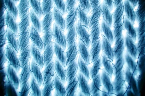 Cotton fabric under 40x magnification, showing the threads ‘locked’ in against each other.