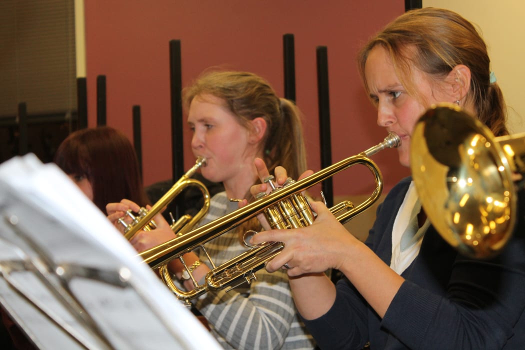 A photo of the All Girl Big Band's trumpet section.