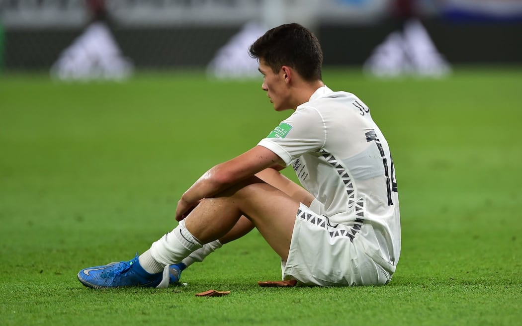 Elijah Just sits dejected at the end of New Zealand All Whites v Costa Rica, FIFA World Cup 2022 play-off match at Ahmad Bin Ali Stadium, Qatar on 14 June 2022.
 © Photo: Tom Kirkwood/www.photosport.nz