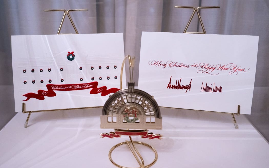 Christmas cards from President Donald Trump and first lady Melania Trump are displayed.