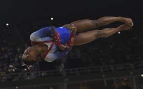 US gymnast Simone Biles competes in the women's floor event final of the Artistic Gymnastics at the Olympic Arena during the Rio 2016 Olympic Games in Rio de Janeiro on August 16, 2016.