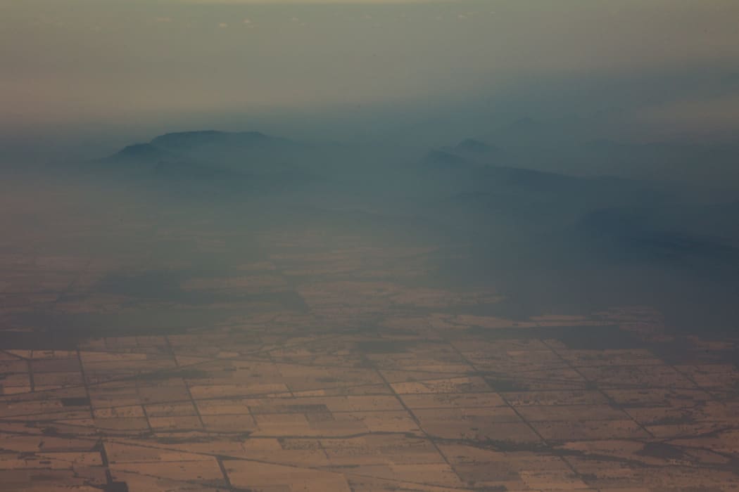 Smoke and haze over mountains seen from an Australian air force aircraft assessing damage in the area from bushfires, in Cooma in New South Wales on 7 January, 2020.