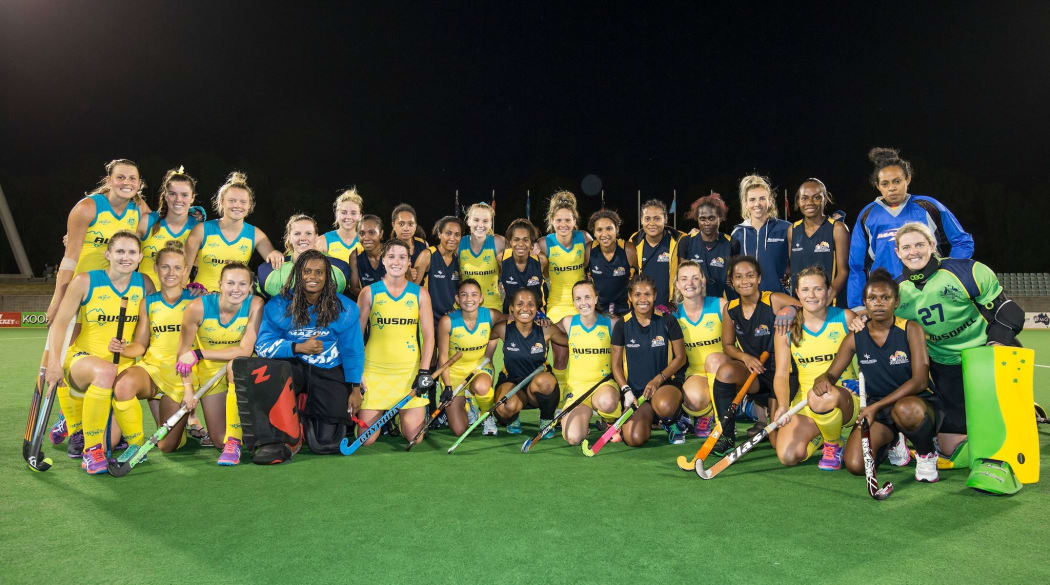 The Australian Hockeyroos and PNG women's team after their Oceania Cup clash.