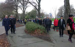 People walking to the proposed site of the national memorial for victims of the February 2011 earthquake on the edge of the Avon River.