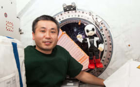 Astronaut Koichi Wakata and Kirobo aboard the International Space Station.