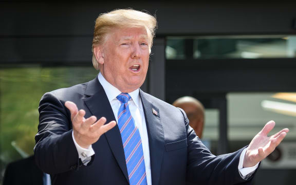 President Donald Trump leaves after holding a press conference ahead of his early departure from the G7 Summit